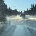 Recent snow melt fills East End Road with water on Sunday. (Photo by Christina Whiting/Homer News)