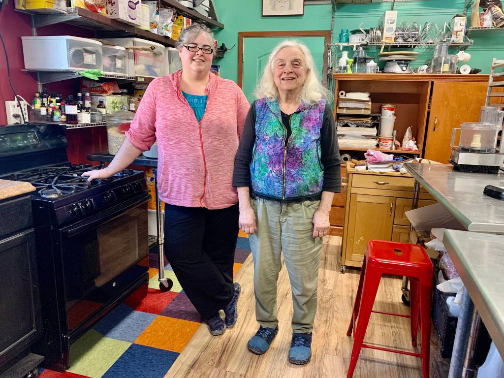 Anna Wall and Sheryl Vitale, daughter-mother duo behind Red Bird Kitchen, stand in their kitchen on East End Road, photo taken March 13, 2023, in Homer, Alaska. (Photo by Christina Whiting/Homr News)
