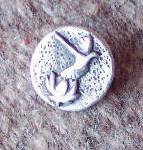 Sterling silver Dove Lotus commemorative pin by Art Koeninger for Celebration of Peace and Reconciliation with American and Vietnamese veterans, 2005, Homer, based on a design by Robert Walsh. (Photo provided by Art copy)