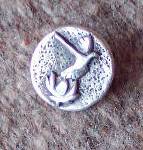 Sterling silver Dove Lotus commemorative pin by Art Koeninger for Celebration of Peace and Reconciliation with American and Vietnamese veterans, 2005, Homer, based on a design by Robert Walsh. (Photo provided by Art copy)