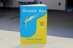 Ashlyn OHara/Peninsula Clarion
A copy of Marie Auberts Grown Ups sits on a desk in The Peninsula Clarion building on Wednesday in Kenai.