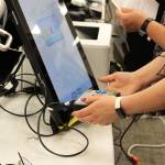 Rachel Nash tests voting equipment at the George A. Navarre Borough building on Thursday, Sept. 9, 2021, in Soldotna, Alaska. (Ashlyn OHara/Peninsula Clarion)