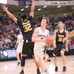 Ninilchiks Kade McCorison drives to the basket against Tikigaq in the Class 2A boys state championship game Saturday, March 18, 2023, at the Alaska Airlines Center in Anchorage, Alaska. (Photo courtesy of Robin Moore)