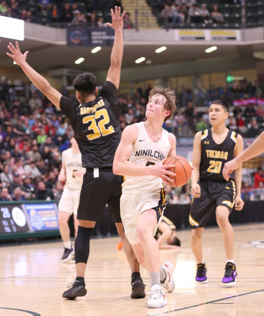Ninilchiks Kade McCorison drives to the basket against Tikigaq in the Class 2A boys state championship game Saturday, March 18, 2023, at the Alaska Airlines Center in Anchorage, Alaska. (Photo courtesy of Robin Moore)