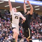 Ninilchiks Cole Moore drives against Tikigaqs Midas Tuzroyluk during the Class 2A boys state championship Saturday, March 18, 2023, at the Alaska Airlines Center in Anchorage, Alaska. (Photo courtesy of Robin Moore)