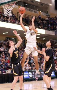 Ninilchiks Jaylin Scott soars to the basket against Tikigaq during the Class 2A boys state championship Saturday, March 18, 2023, at the Alaska Airlines Center in Anchorage, Alaska. (Photo courtesy of Robin Moore)