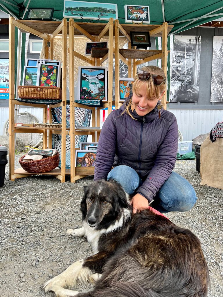 Photo by Courtney Martin
Seldovia artist Valisa Higman and her dog at the 4th of July celebrations in Seldovia 2022.