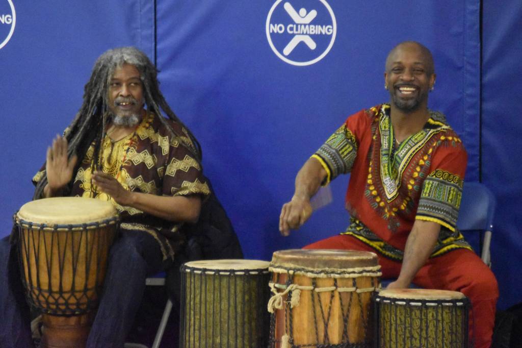 The members of Sankofa Dance Theater Alaska perform for a crowd of students during an opening performance at Kaleidoscope School of Arts and Science in Kenai, Alaska on Monday, March 20, 2023. (Jake Dye/Peninsula Clarion)