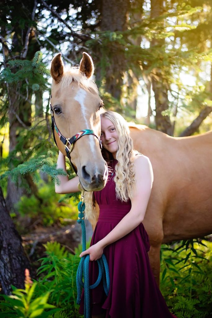 Photo taken by Olivia Honey Photography / courtesy 
Jordan Barrowcliff and her horse Whisper are seen in this senior portrait 2022. Barrowcliff is the 2023 Haven House Women of Distinction Young Woman of Distinction award recipient.