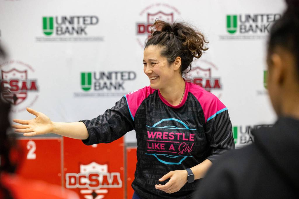 Photo provided by Tela ODonnell Bacher 
Tela ODonnell Bacher coaches wrestling in September 2022 at Newhalen School in Dillingham. Bacher is the 2023 Haven House Women of Distinction Woman of Distinction award recipient.