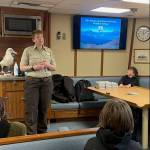 Kendra Bush introduces the Alaska Maritime National Wildlife Refuge to Fireweed students onboard the R/V Tiglax in Homer on April 6. (Photo by Emilie Springer/ Homer News)