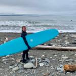 Johnny Sheffler prepares to hit the waves on the Homer Spit on Saturday<ins>, April 15, 2023 in Homer, Alaska</ins>. (Photo by Christina Whiting)