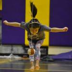 Cameron Ivanoff, competing for the Kenaitze Indian Tribe, performs the 2-Foot High Kick during the Salamatof Tribe Traditional Native Games Invitational at Kenai Middle School in Kenai, Alaska, on Sunday, April 16, 2023. (Jake Dye/Peninsula Clarion)