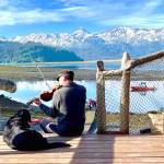 Daniel Perry plays the violin on the steps outside Kachemak Bay Wilderness Lodge in the summer of 2021 in Homer, Alaska. Photo provided by Daniel Perry