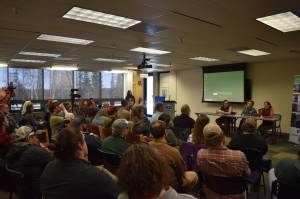 Cook Inletkeeper Science Director Sue Mauger speaks in front of a packed crowd during a panel discussion for the Kenai Peninsula College Showcase State of the Salmon on Wednesday, April 20, 2023, at KPC in Soldotna, Alaska. (Jake Dye/Peninsula Clarion)