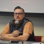 University of Alaska Fairbanks Associate Professor Dr. Peter Westley responds to a question during a panel discussion for the Kenai Peninsula College Showcase State of the Salmon on Wednesday, April 20, 2023, at KPC in Soldotna, Alaska. (Jake Dye/Peninsula Clarion)