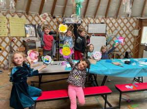 Fireweed Kindergarten, first and second grade students in the Makerspace afterschool club sponsored by Homer Council on the Arts make flowers to decorate for the May Day celebration.  Emilie Springer/ Homer News