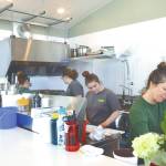 Photo by Delcenia Cosman
The Tickled Pear staff fill orders during their grand opening in their new permanent location on Friday, May 5,. Owner Ashley Steiner is pictured second from left.