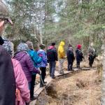 Community members and visitors enjoy a Beginners Bird Walk on the Calvin and Coyle Trail guided by AMNWR Visitor Center Manager Lora Hollar on Thursday, May 4. Photo by Christina Whiting