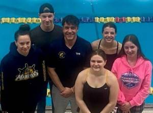 Kachemak Swim Club swimmers Carly Nelson, Hunter Fry, Coach Caleb Miller, Evelyn Sherwood, Etta Bynagle and Izzy Clarke on April 29 at the Bartlett High School pool in Anchorage, Alaska.  Photo provided by Kachemak Swim Club/ Amanda Piaskowski