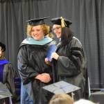 University of Alaska Southeasts Dr. Christine Ermold (right) presents Rachel Ostler with her diploma and masters hood during the 2023 KBC Commencement on Wednesday, May 10, 2023 in Homer, Alaska. Ostler completed her Master of Arts degree in Education through UAS. (Photo by Delcenia Cosman/Homer News)