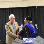 Kachemak Bay Campus Director Dr. Reid Brewer (right) presents the KBC Directors Choice award to KBC advisory board member and student Wayne Aderhold (right) during the 2023 KBC Commencement on Wednesday, May 10, 2023, in Homer, Alaska. (Photo by Delcenia Cosman/Homer News)