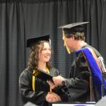 Kachemak Bay Campus Assistant Professor of Mathematics Dr. Jeff Johnson (right) presents the KBC Faculty Choice Award to valedictorian Elizabeth Rozeboom (left) during the 2023 KBC Commencement on Wednesday, May 10, 2023, in Homer, Alaska. (Photo by Delcenia Cosman/Homer News)