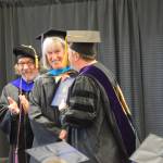 University of Alaska Fairbankss Dr. Peter Westley presents Dorothy Sherwood with her diploma and masters hood during the 2023 KBC Commencement on Wednesday, May 10, 2023 in Homer, Alaska. Sherwood earned her One Health Masters degree through UAF. (Photo by Delcenia Cosman/Homer News)