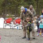 Members of the Kenai River Professional Guide Association teach elementary students to cast a fly rod during Salmon Celebration on Wednesday, May 10, 2023, at Johnson Lake in Kasilof, Alaska. (Jake Dye/Peninsula Clarion)