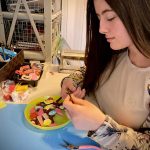 Emma Early assembles earrings in her familys home studio, May 11, 2023, in Homer, Alaska. (Photo provided by Tracy Early)