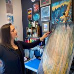 Tracy Early works on the background of a new painting as part of an upcoming series, May 11, 2023, in Homer, Alaska. (Photo provided by Tracy Early)