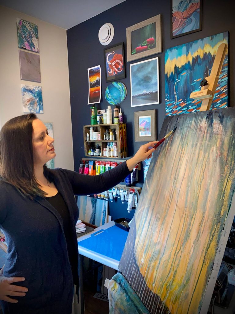 Tracy Early works on the background of a new painting as part of an upcoming series, May 11, 2023, in Homer, Alaska. (Photo provided by Tracy Early)