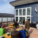 Community members enjoy the deck on opening day of The Tickled Pear restaurant, formerly a food truck, May 5, 2023. (Photo provided by Stephanie Greer)
