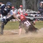 Soldotna catcher Ari Miller tags out Wasillas Whalen Halverson at the plate Saturday, May 13, 2023, at the Soldotna Little League fields in Soldotna, Alaska. (Photo by Jeff Helminiak/Peninsula Clarion)