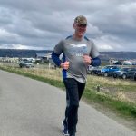 Sergeant Dave Shealy runs along the Homer Spit bike path, participating in the Annual Law Enforcement Torch Run for Special Olympics on Saturday, May 20.