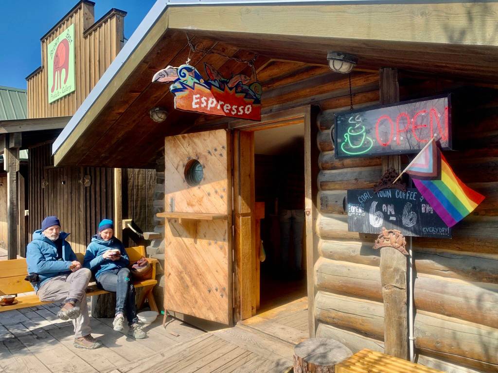Photos by Christina Whiting
Alan Cresswell from France and the U.S. and Annina from Switzerland enjoy coffee and sunshine on the Homer Spit boardwalk on Tuesday, May 16.