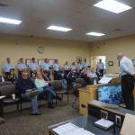 Mayor Ken Castner reads a proclamation announcing Homer as an official Coast Guard City at Homer City Hall on May 22. (Photo provided by Homer city manager)