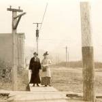 Photo #1.628 courtesy of the Seward Community Library Association
Dr. John Baughmans wife, Mina (left), poses in this circa 1905-10 photo with Mrs. E.E. Hale on a Seward city sidewalk near the Alaska Central Railroad and Sewards first school.