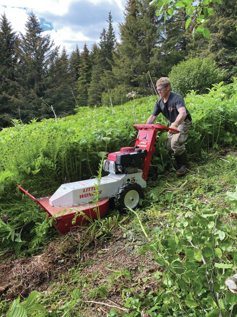 Homer Cycling Club volunteer Jason Herreman mowing trails along the Homestead Trail. (Photo provided by Homer Trails Alliance)