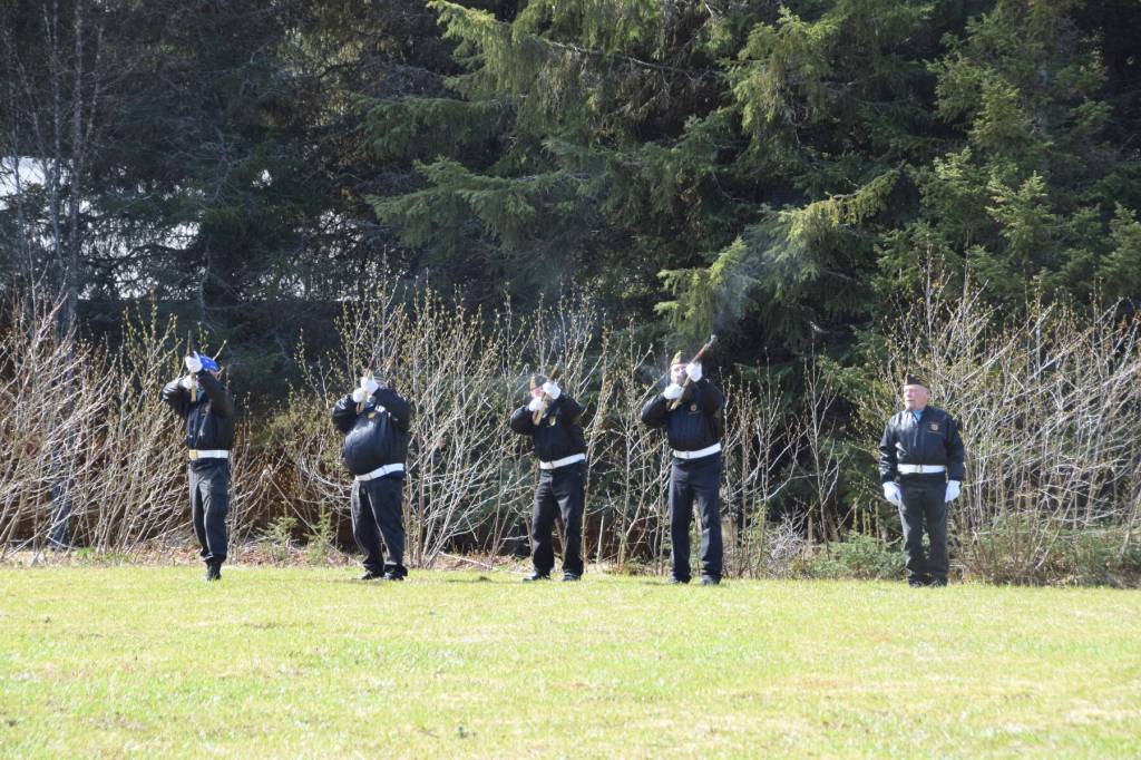 VFW Post 10221 post member Frances Richter (right) calls cadence as honor guard members Joe Keller, Brian Malneritch and Clyde Hixson fire a gun salute during a Memorial Day service held at the Anchor Point Kallman Cemetery on Monday, May 29, 2023 in Anchor Point, Alaska. (Delcenia Cosman/Homer News)