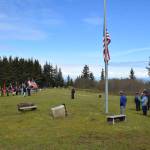 Community members attend a Memorial Day service hosted by VFW Post 10221 at the Anchor Point Kallman Cemetery on Monday, May 29, 2023 in Anchor Point, Alaska. (Delcenia Cosman/Homer News)