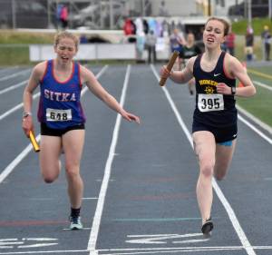 Homers Eryn Field holds off Sitkas Clare Mullin to win the Division II 1,600-meter relay Saturday, May 27, 2023, at the state track and field meet at Palmer High School in Palmer, Alaska.