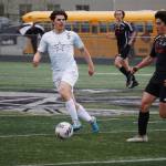 Soldotnas Gehret Medcoff and Juneau-Douglas Gabriel Cheng race for the ball during the Division II Soccer State Championship on Saturday, May 27, 2023, at West Anchorage High School in Anchorage, Alaska. (Jake Dye/Peninsula Clarion)