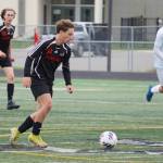 Juneau-Douglas Kai Ciambor moves at the ball during the Division II Soccer State Championship on Saturday, May 27, 2023, at West Anchorage High School in Anchorage, Alaska. (Jake Dye/Peninsula Clarion)