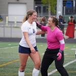 Soldotnas Alexandra Lee and Sunny Miller celebrate after the end of the fourth half of overtime during the Division II Soccer State Championship on Saturday, May 27, 2023, at West Anchorage High School in Anchorage, Alaska. (Jake Dye/Peninsula Clarion)