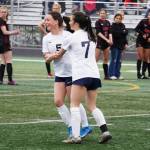 Soldotnas Piper Bloom celebrates with Bay Bloom after Bay scored a goal during the Division II Soccer State Championship on Saturday, May 27, 2023, at West Anchorage High School in Anchorage, Alaska. (Jake Dye/Peninsula Clarion)