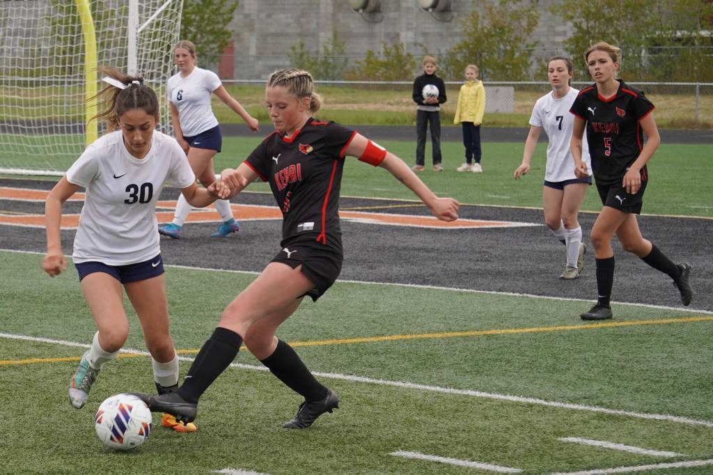 Soldotnas Zayra Poage battles for the ball with Kenai Centrals Kori Moore during the Division II Soccer State Championship on Saturday, May 27, 2023, at West Anchorage High School in Anchorage, Alaska. (Jake Dye/Peninsula Clarion)