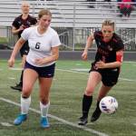Soldotnas Alexandra Lee and Kenai Centrals Kori Moore race after the ball during the Division II Soccer State Championship on Saturday, May 27, 2023, at West Anchorage High School in Anchorage, Alaska. (Jake Dye/Peninsula Clarion)