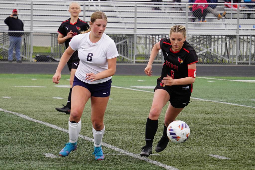 Soldotnas Alexandra Lee and Kenai Centrals Kori Moore race after the ball during the Division II Soccer State Championship on Saturday, May 27, 2023, at West Anchorage High School in Anchorage, Alaska. (Jake Dye/Peninsula Clarion)