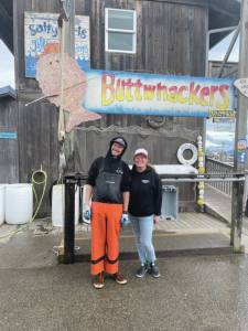 Emilie Springer/ Homer News
George Gustufson and Ayjan Arik, owners of Buttwhackers Fillet Company, stand in front of their business, at the top of Ramp 1 behind the Salty Dawg at the Homer Harbor on Monday. The business is the 2023 tournament headquarters and weigh-in station.